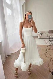 Flowing midi dress for women with a U-neck and ruffled hem