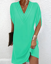 Women's dress with V-neck, short sleeves, and ruffle details