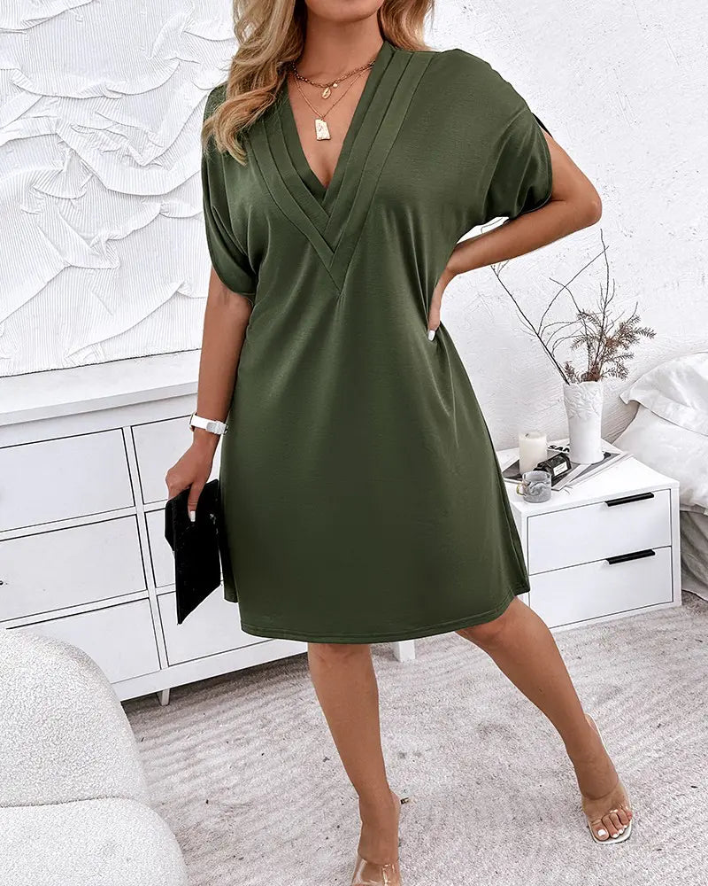 Women's dress with V-neck, short sleeves, and ruffle details