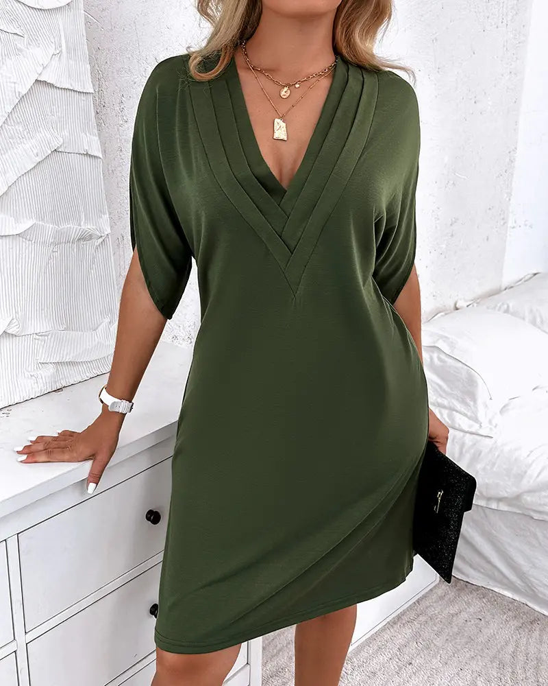 Women's dress with V-neck, short sleeves, and ruffle details