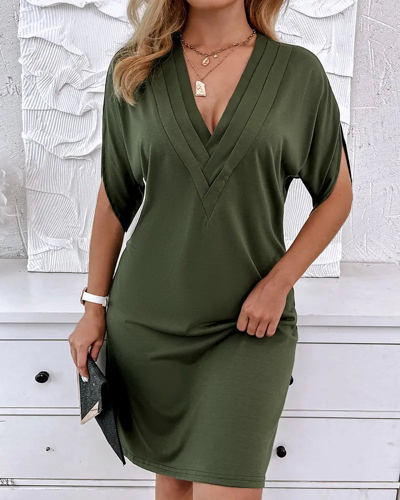 Women's dress with V-neck, short sleeves, and ruffle details