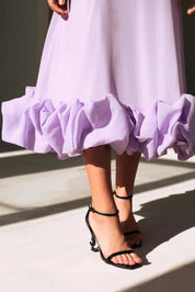 Flowing midi dress for women with a U-neck and ruffled hem