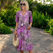 Women's dress with V-neck and stitched hem