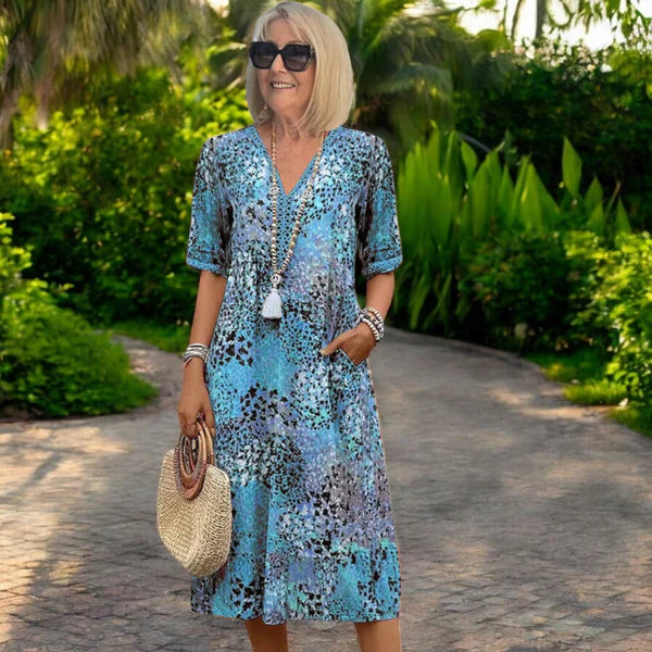 Women's dress with V-neck and stitched hem