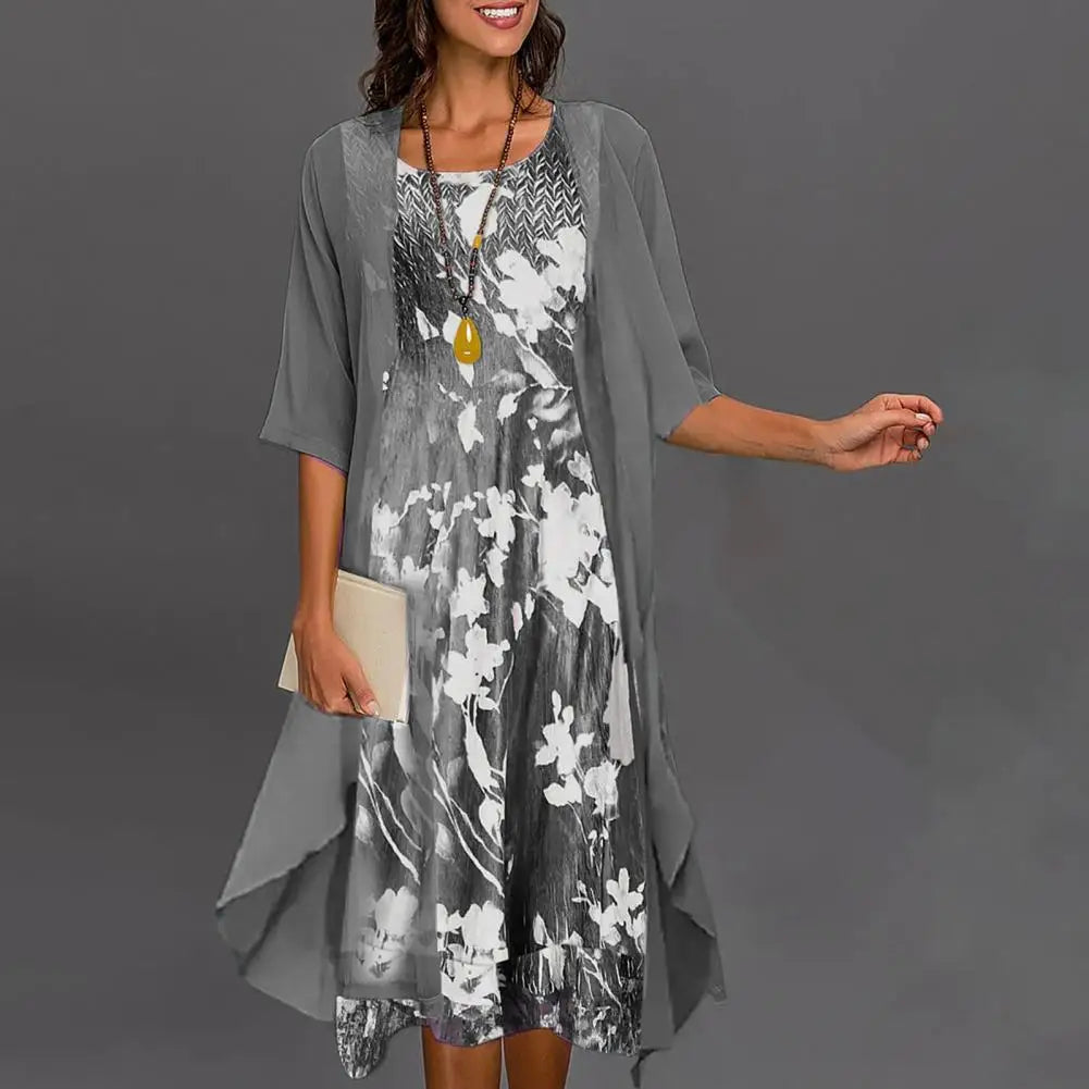 Two-piece women's summer dress with floral underdress and transparent overlay
