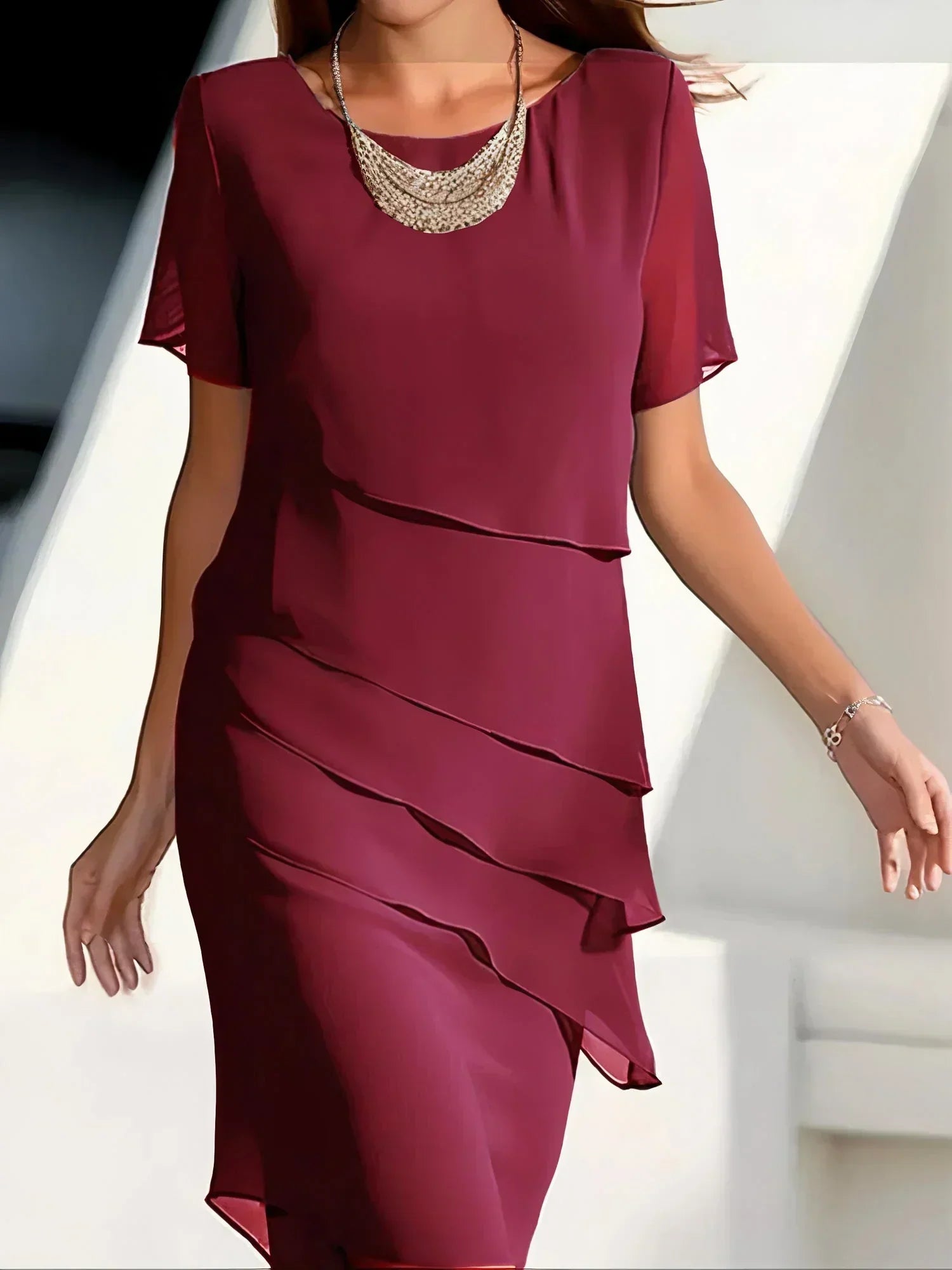 Women's layered dress with cascading fabric and short sleeves