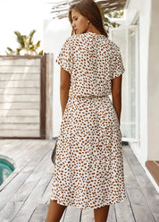 Women's short-sleeved dress with a round neckline and stitched hem