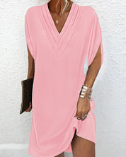 Women's dress with V-neck, short sleeves, and ruffle details