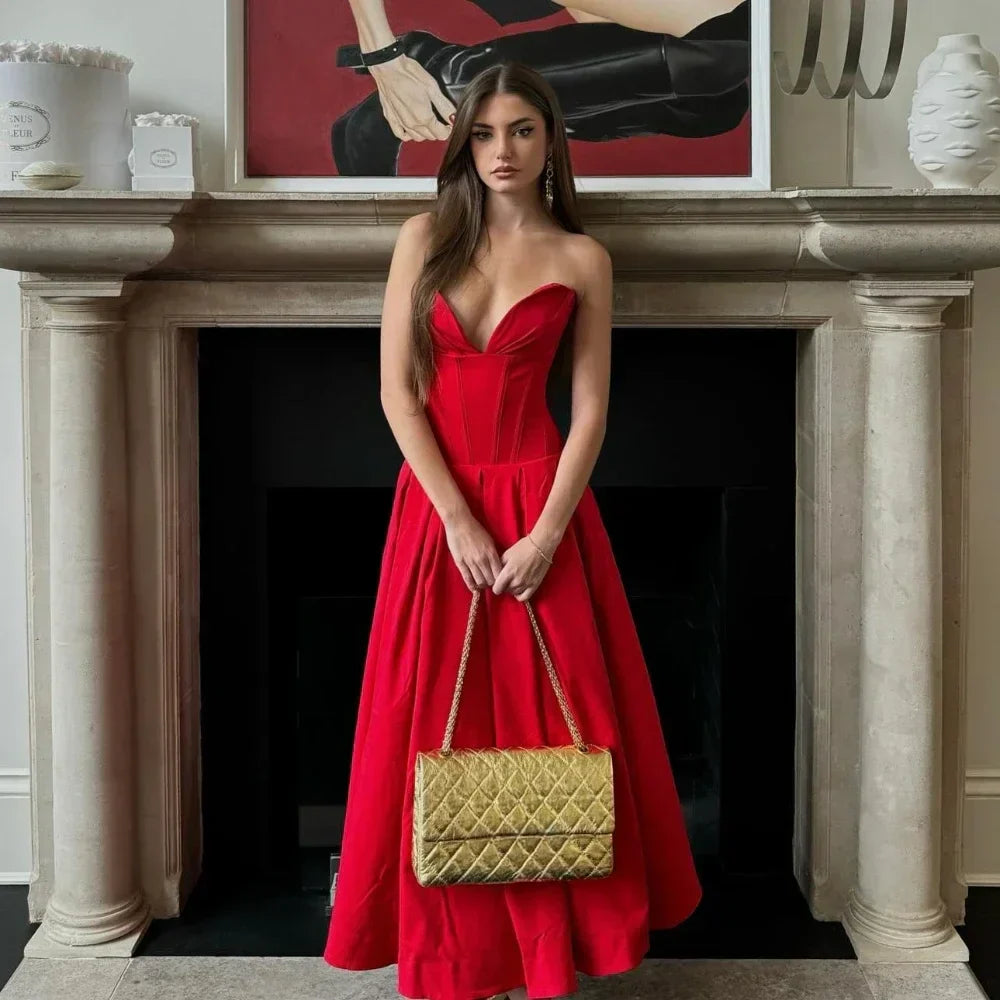 Women's midi dress in red polyester blend fabric with pleats and strapless neckline