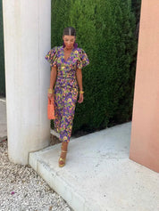 Women's midi dress with puff sleeves, figure-hugging cut and twisted waist