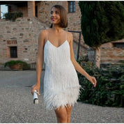 Mini cocktail dress for women with sequins and feather trim