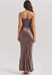 Strapless satin evening dress for women with a gathered detail at the hip.