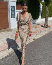Women's midi dress with floral pattern and pleated waist