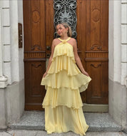 Maxi dress for women with ruffles and back cutout as well as halter neckline